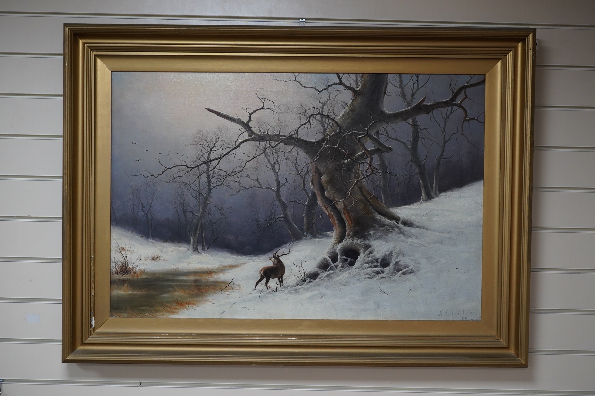 Nils Hans Christiansen (Danish, 1850-1922), oil on canvas, Deer beneath a tree, signed, 59 x 89cm, gilt framed. Condition - good